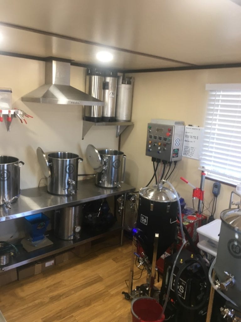 Interior View of Lofted Cabin with Stoves and Ovens