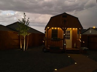Deluxe Lofted Cabin at Night with Porch Lights