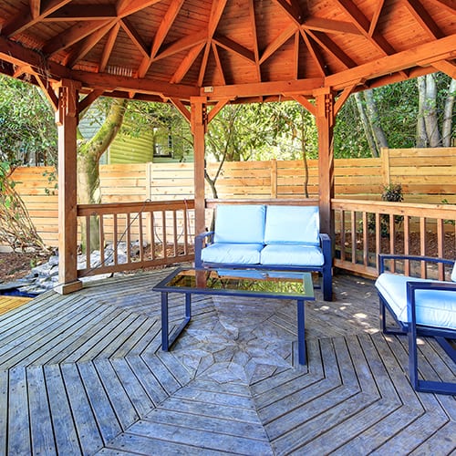 Fabulous gazebo on backyard deck with outdoor furniture